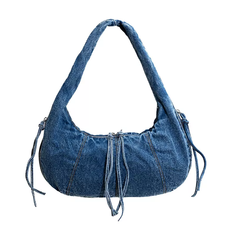 Wat is een okseltas en waarom is het een must-have modeaccessoire?